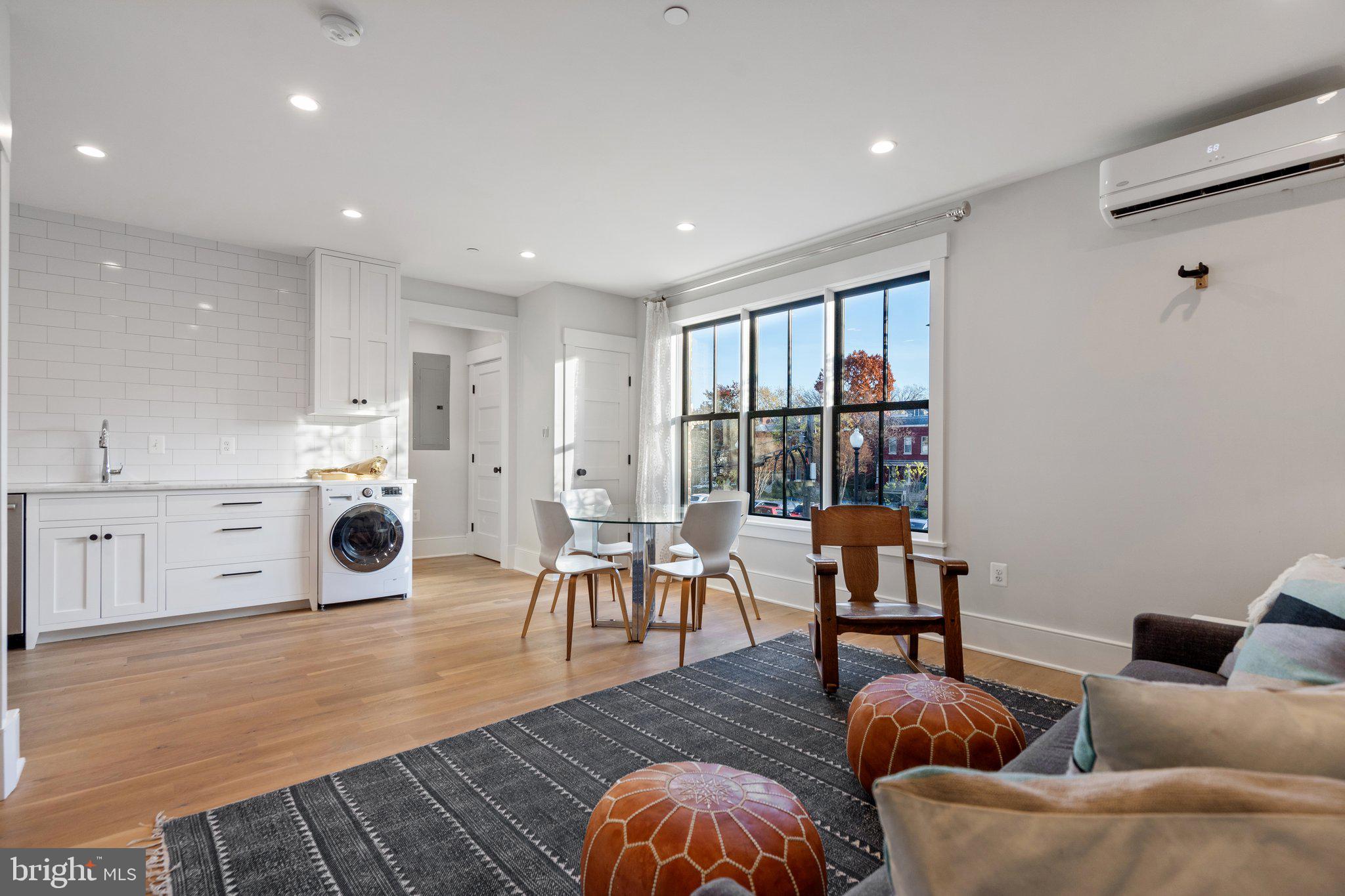 214 A Street Northeast Washington, DC 20002 - Photo 58 of 78 a living room with furniture wooden floor and a fireplace