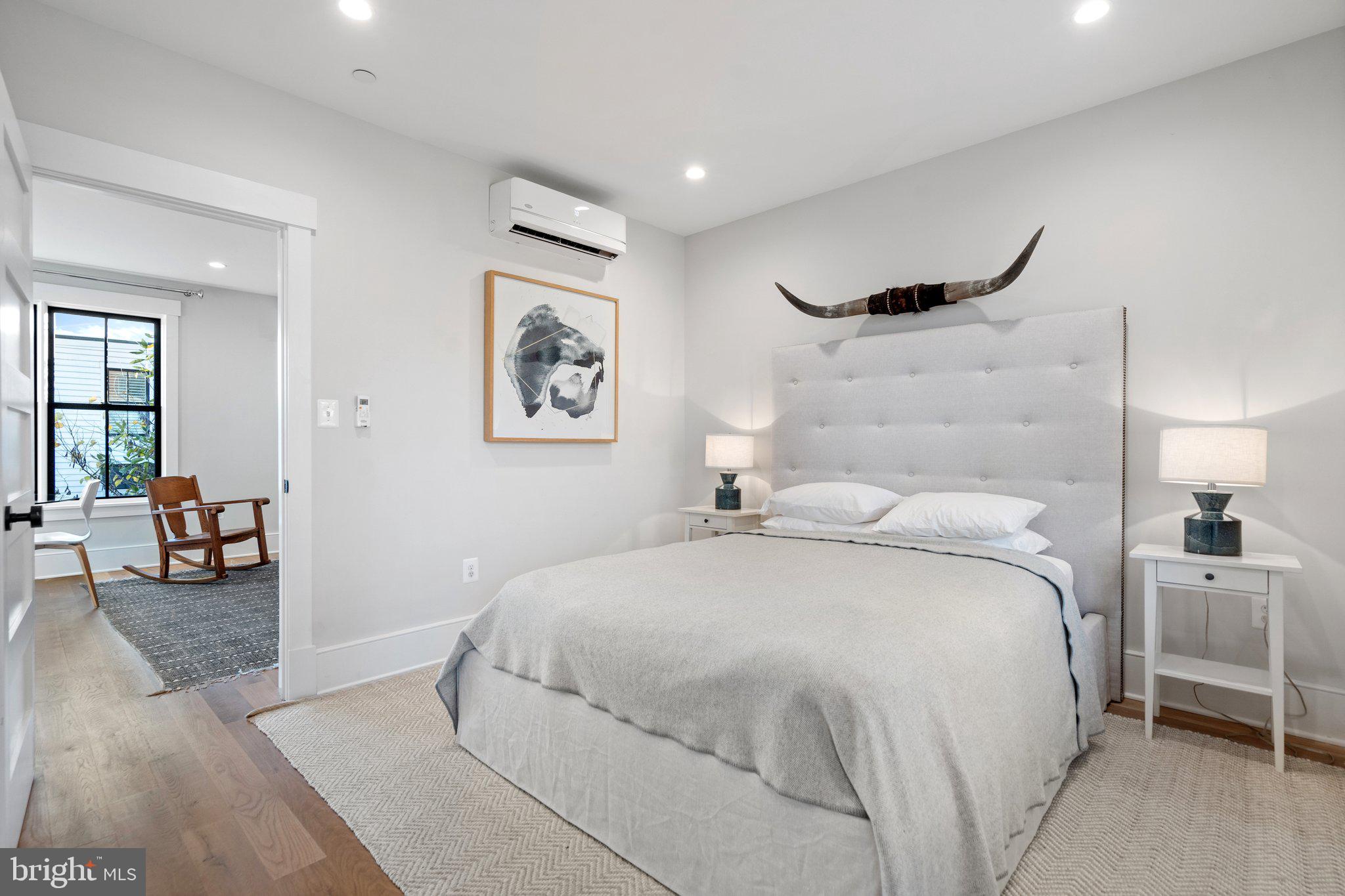 214 A Street Northeast Washington, DC 20002 - Photo 63 of 78 a bedroom with a bed and a couch