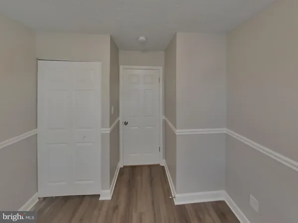 a view of small space with wooden floor