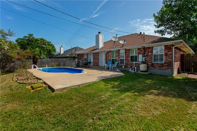 a view of a house with a yard porch and sitting area