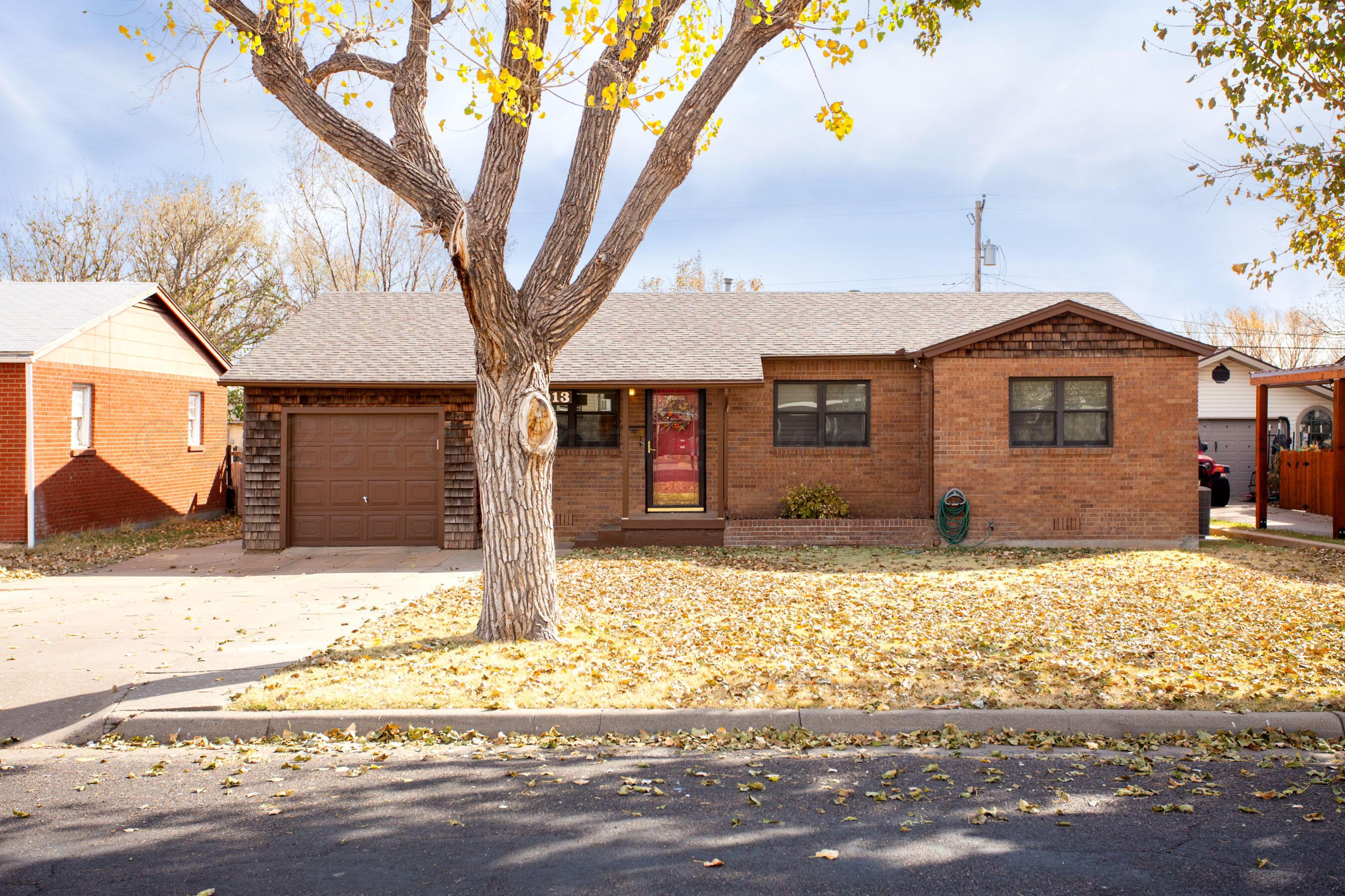 5013 South Bonham Street Amarillo, TX 79110 - Photo 1 of 27 a front view of a house with a yard