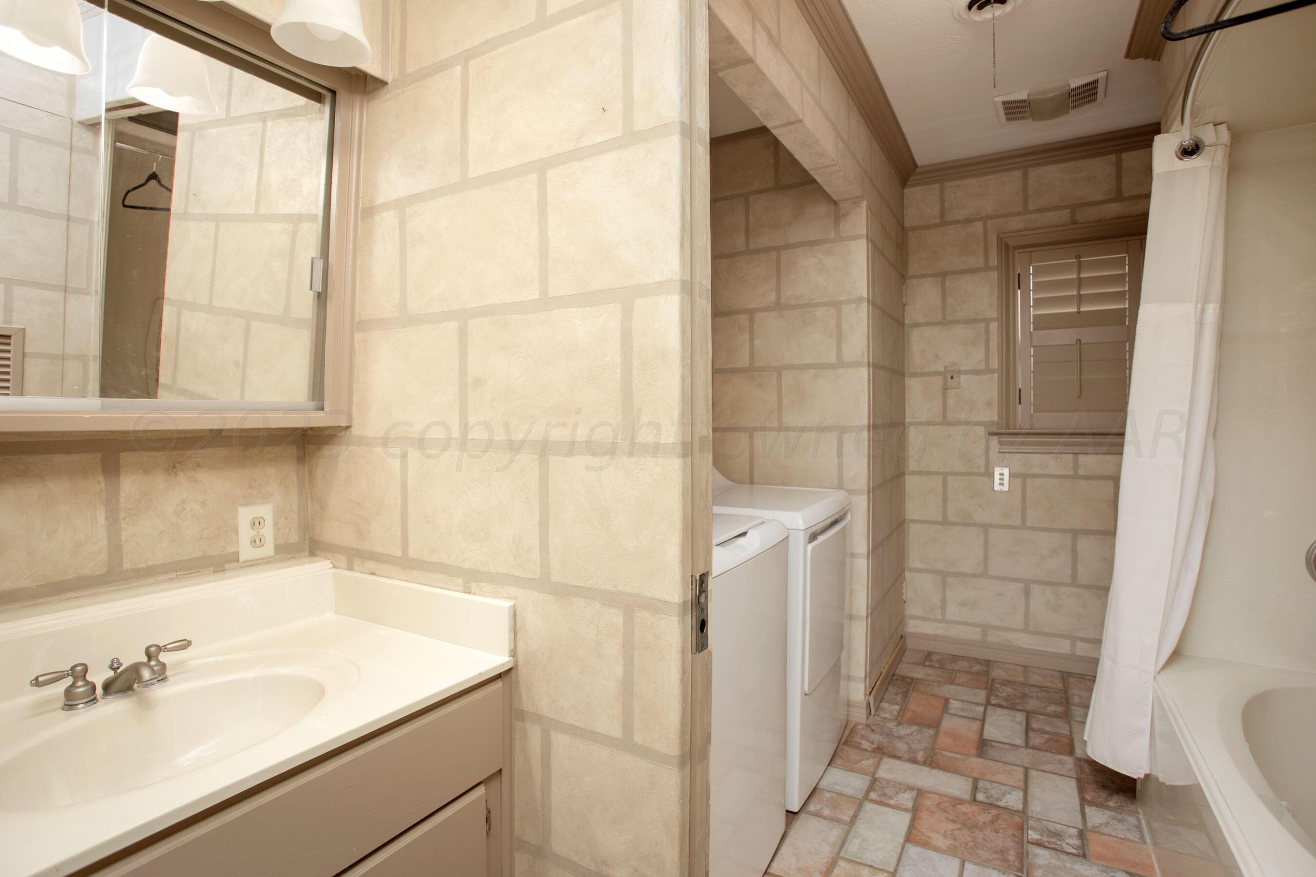 5013 South Bonham Street Amarillo, TX 79110 - Photo 17 of 27 a bathroom with a sink and a shower