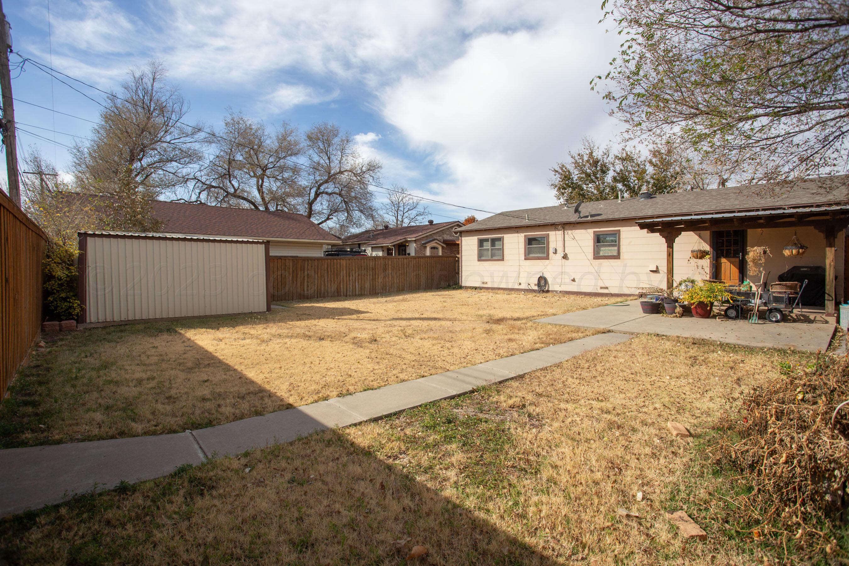5013 South Bonham Street Amarillo, TX 79110 - Photo 24 of 27 a view of house with yard and trees in the background