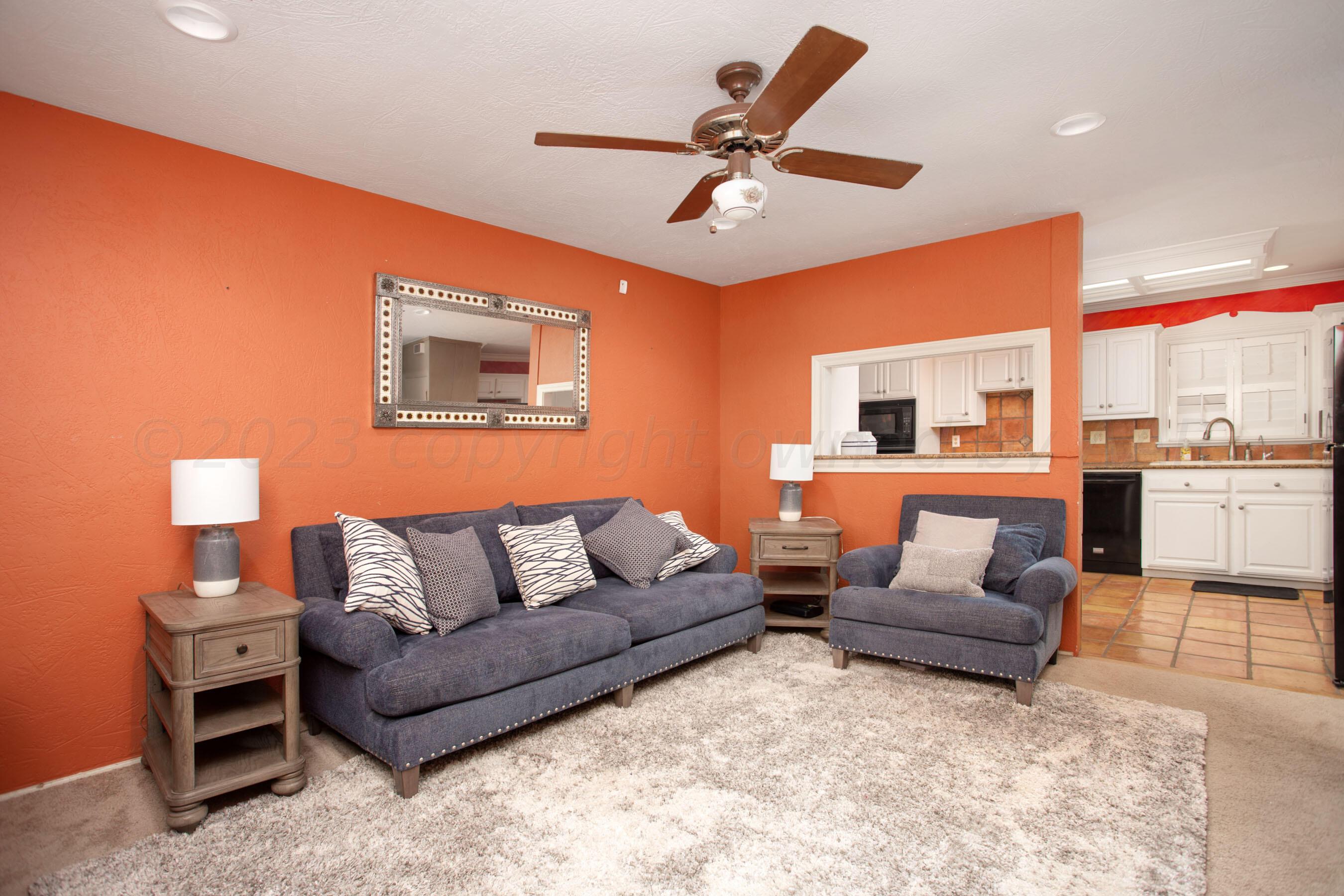 5013 South Bonham Street Amarillo, TX 79110 - Photo 3 of 27 a living room with furniture and a large window