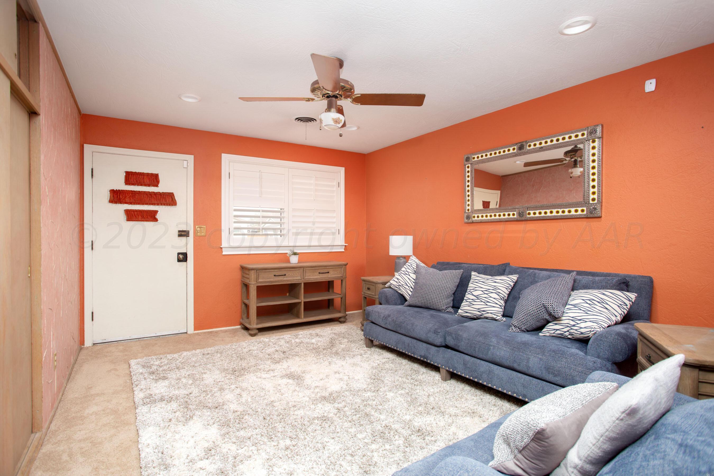 5013 South Bonham Street Amarillo, TX 79110 - Photo 4 of 27 a living room with furniture and a window