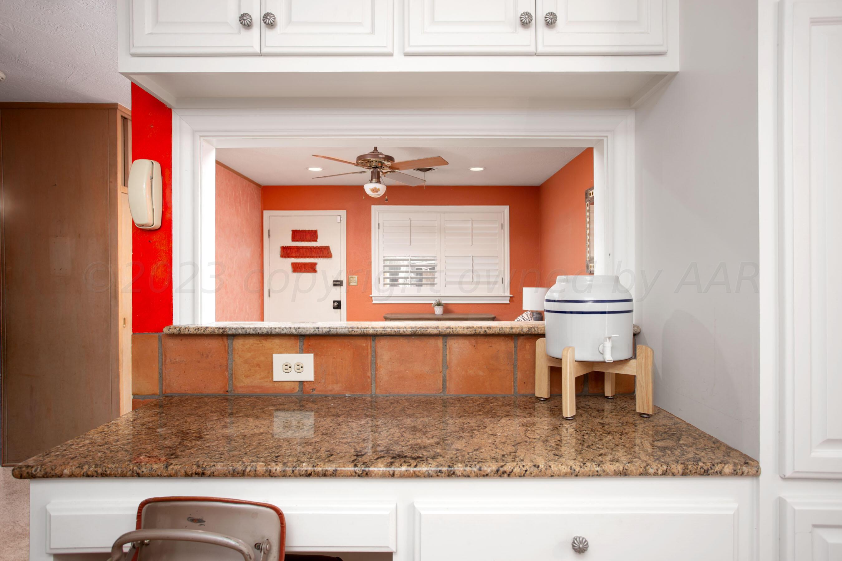 5013 South Bonham Street Amarillo, TX 79110 - Photo 10 of 27 a view of a kitchen sink and dining table