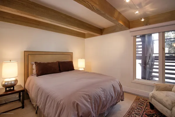 a bathroom with a sink mirror vanity and toilet
