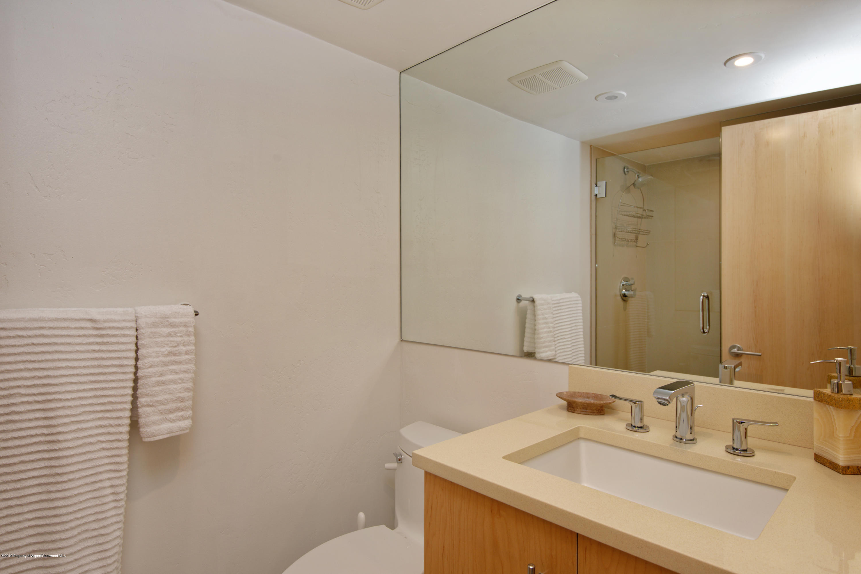 1034 East Cooper Avenue, Unit 5A Aspen, CO 81611 - Photo 8 of 15 a bathroom with a sink and a mirror
