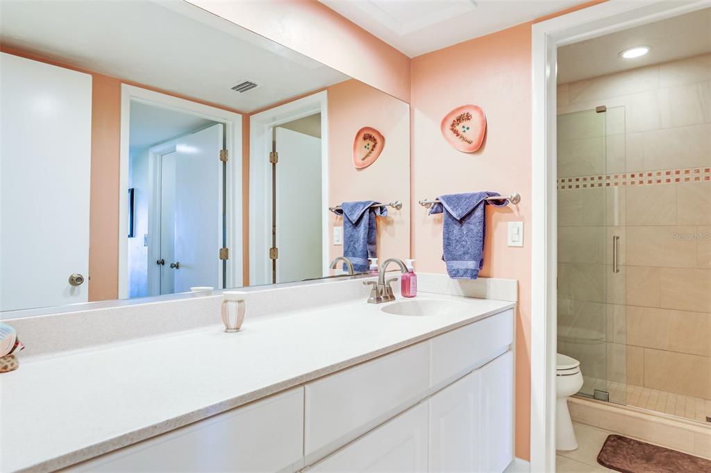 2955 North Beach Road, Unit A432 Englewood, FL 34223 - Photo 12 of 24 a bathroom with a sink and a mirror