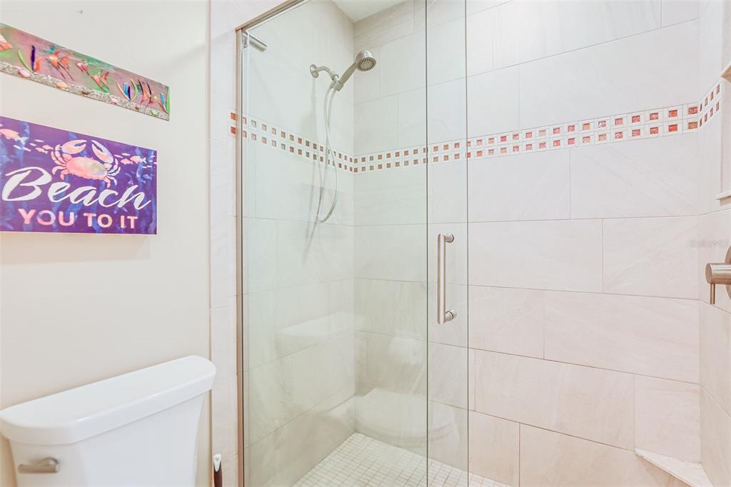 2955 North Beach Road, Unit A432 Englewood, FL 34223 - Photo 13 of 24 a bathroom with a shower and a toilet