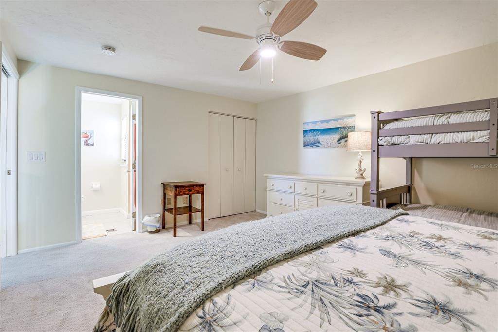 2955 North Beach Road, Unit A432 Englewood, FL 34223 - Photo 15 of 24 a bedroom with a bed and a dresser