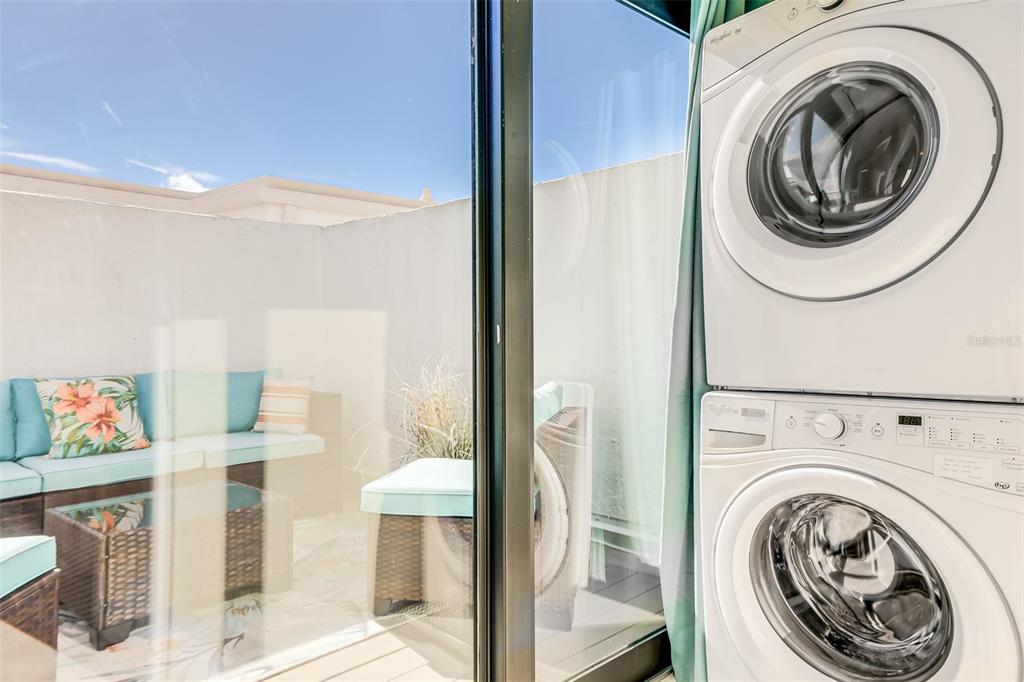 2955 North Beach Road, Unit A432 Englewood, FL 34223 - Photo 17 of 24 a view of a bedroom with washer and dryer