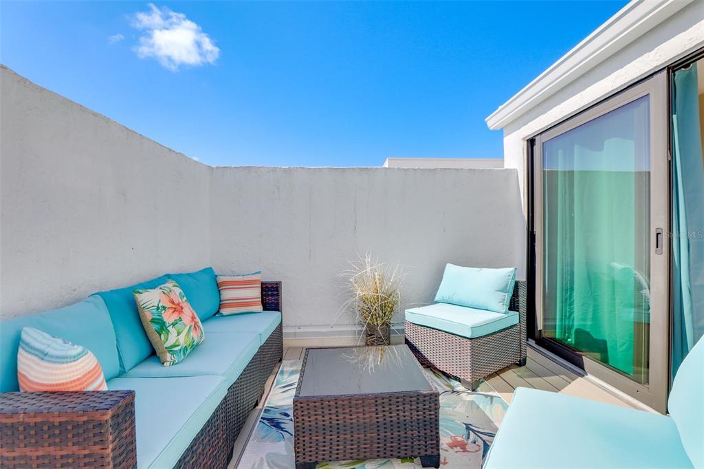 2955 North Beach Road, Unit A432 Englewood, FL 34223 - Photo 18 of 24 a living room with furniture and a lamp