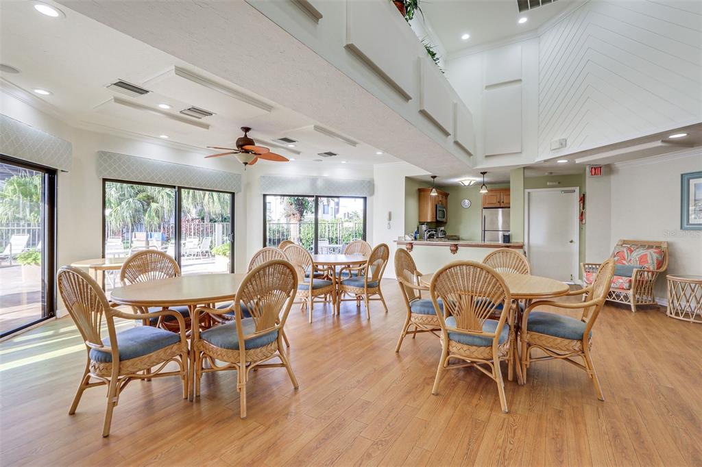 2955 North Beach Road, Unit A432 Englewood, FL 34223 - Photo 24 of 24 a view of a dining room with furniture window and wooden floor