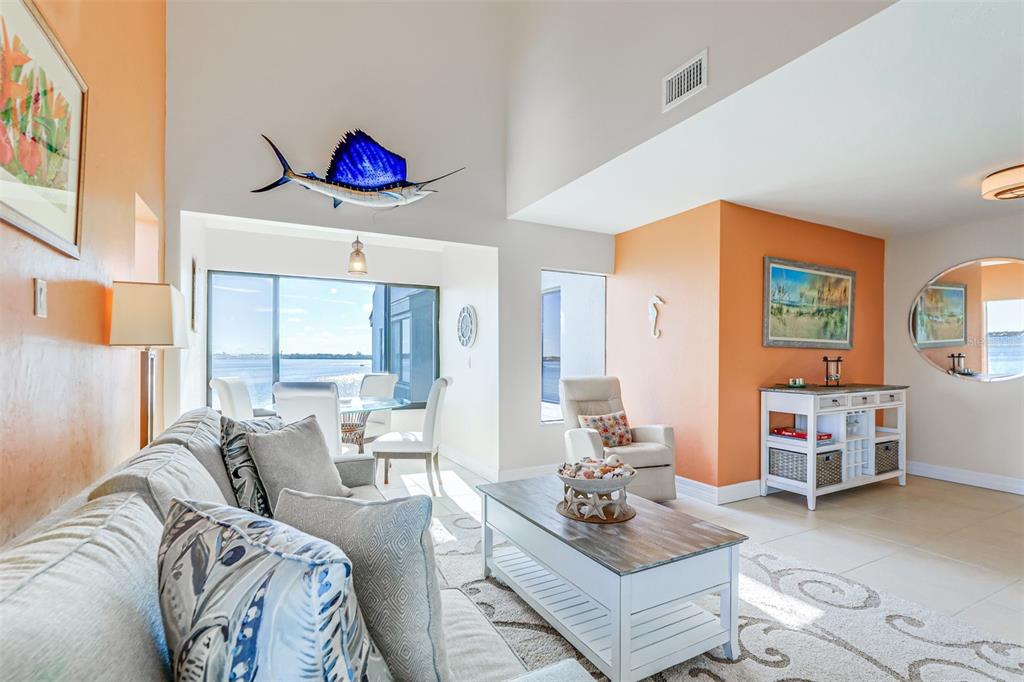 2955 North Beach Road, Unit A432 Englewood, FL 34223 - Photo 5 of 24 a living room with furniture and a couch