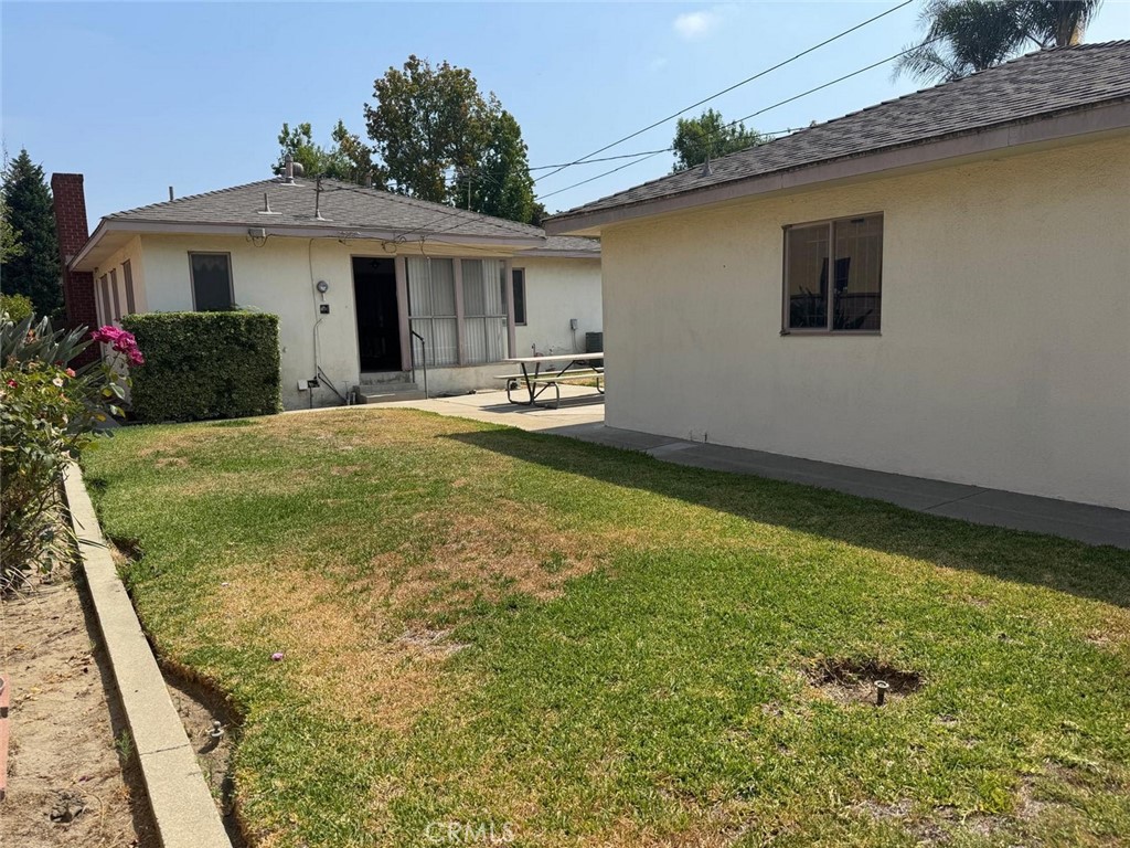 7814 4th Street Downey, CA 90241 - Photo 20 of 22 a view of a house with backyard and porch