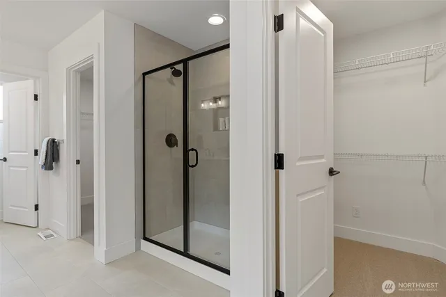 a bedroom with a bed and a couch