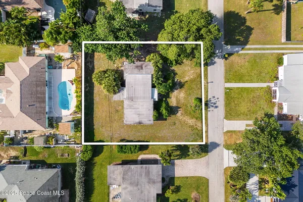 an aerial view of residential houses and outdoor space