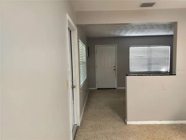 a view of a hallway with closet