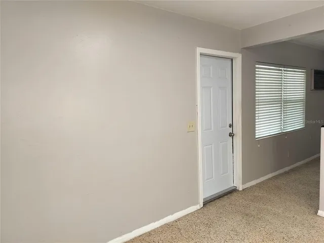 a view of an empty room with window