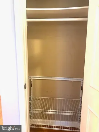 a view of a room with racks on the wall