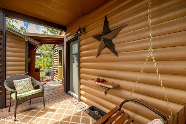 a view of a livingroom with furniture and a large window