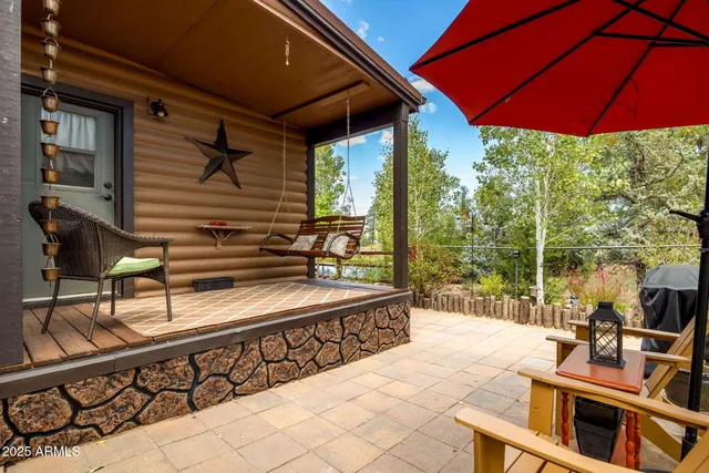 a view of a chairs and table in the patio