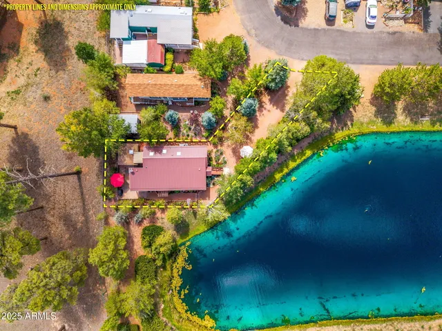 an aerial view of residential houses with outdoor space and street view