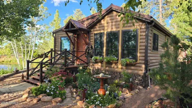 a view of a chair and tables in the patio in front of a house