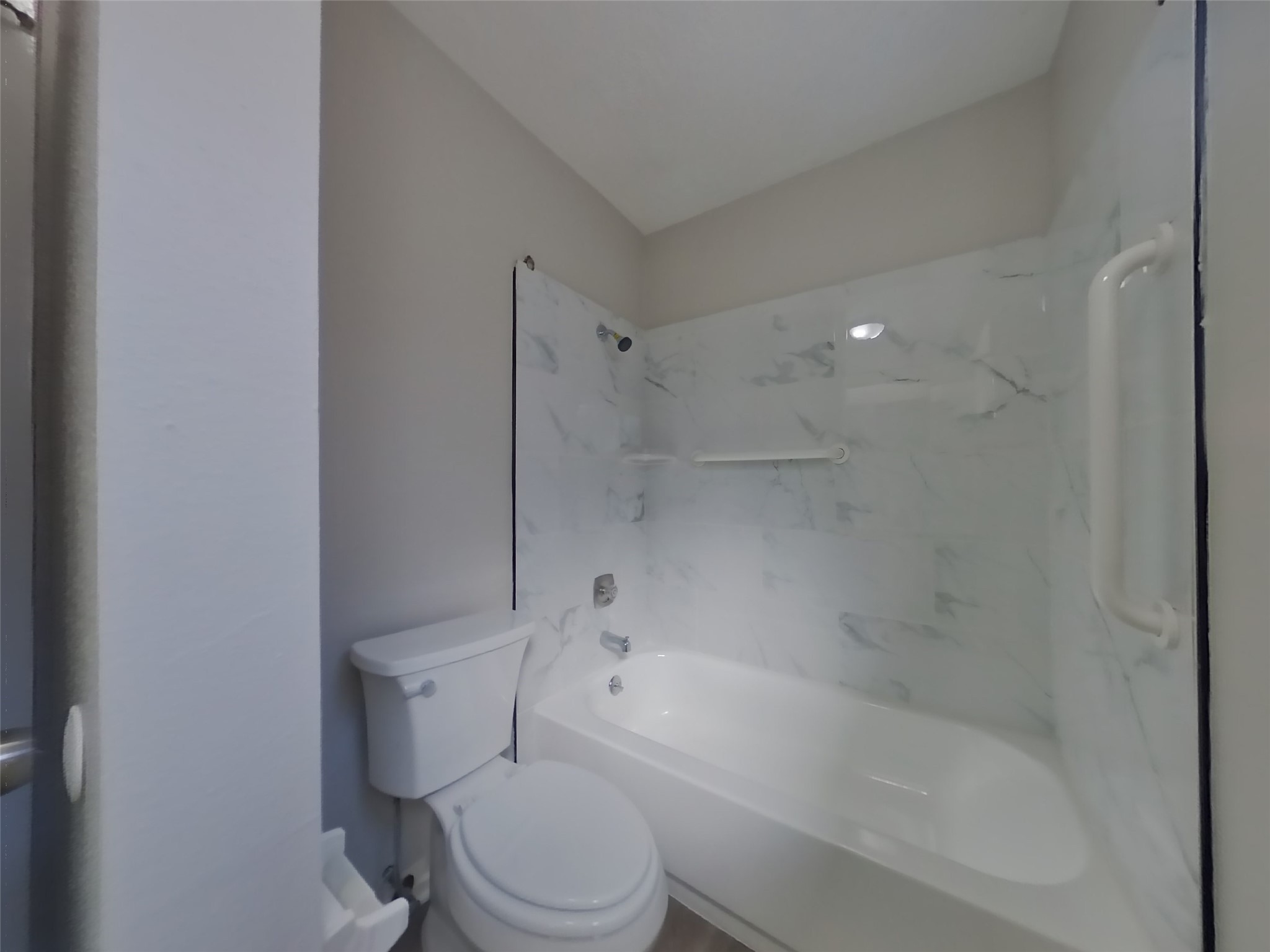 17226 Modbury Drive Spring, TX 77379 - Photo 14 of 20 a white toilet sitting next to a bath tub
