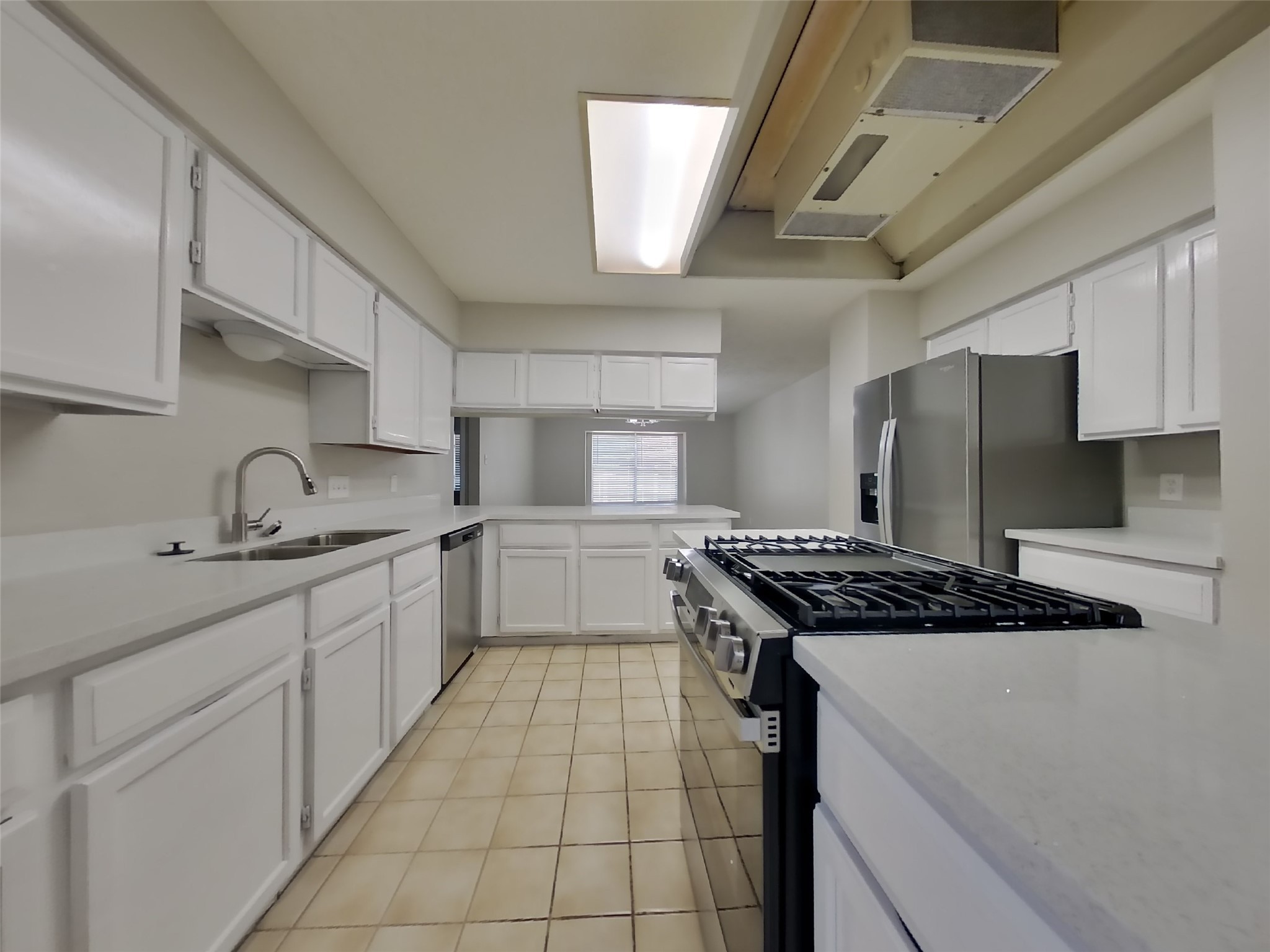 17226 Modbury Drive Spring, TX 77379 - Photo 5 of 20 a kitchen with stainless steel appliances granite countertop a sink stove and cabinets