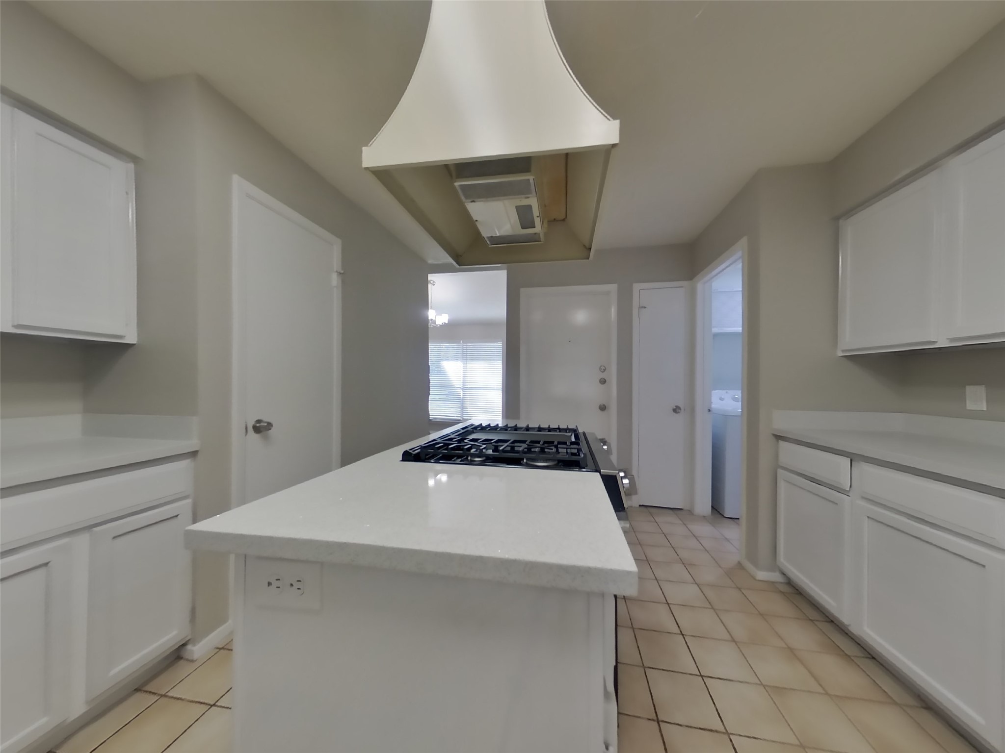 17226 Modbury Drive Spring, TX 77379 - Photo 6 of 20 a kitchen with a stove a white cabinets and a sink