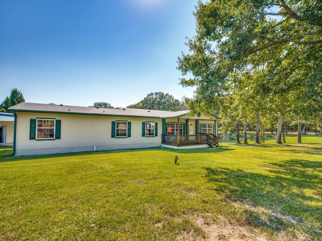 233 Esquire Estates Road Mabank, TX 75156 - Photo 2 of 34 View of front of home with a front yard and covered porch