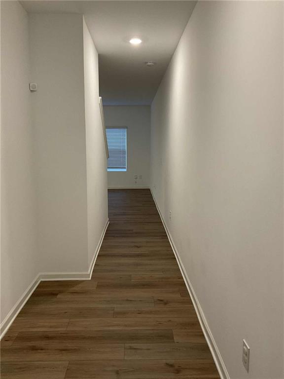 1410 Ben Park Way Grayson, GA 30017 - Photo 2 of 10 a view of a hallway with wooden floor