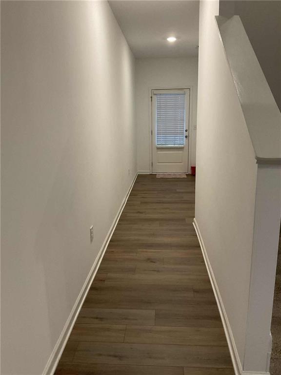 1410 Ben Park Way Grayson, GA 30017 - Photo 3 of 10 a view of a hallway with wooden floor and staircase