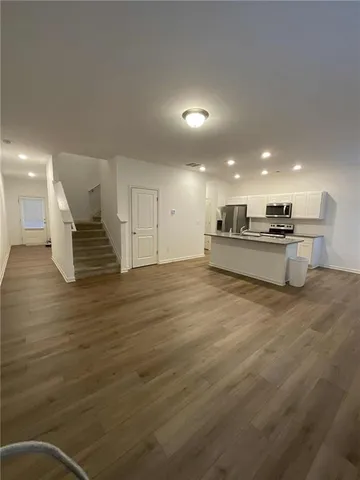 a view of kitchen with cabinets