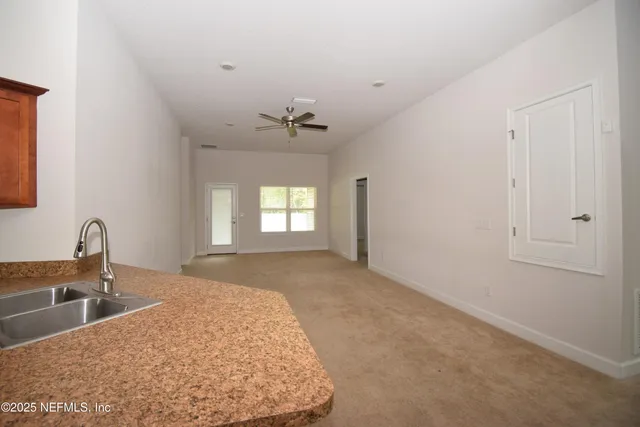 a view of a kitchen and a sink
