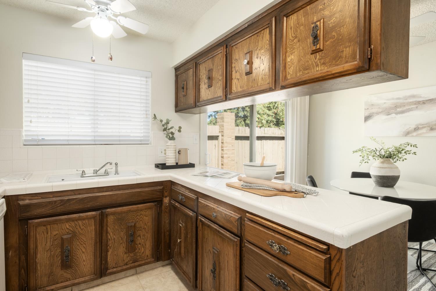 4849 North 7th Street, Unit F Fresno, CA 93726 - Photo 18 of 23 a kitchen with a sink stove and cabinets