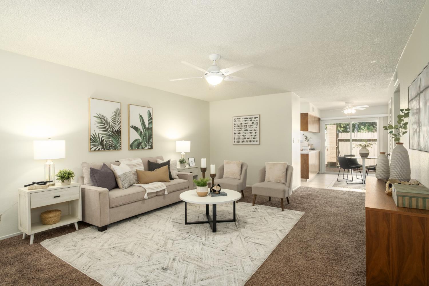 4849 North 7th Street, Unit F Fresno, CA 93726 - Photo 2 of 23 a living room with furniture and a couch
