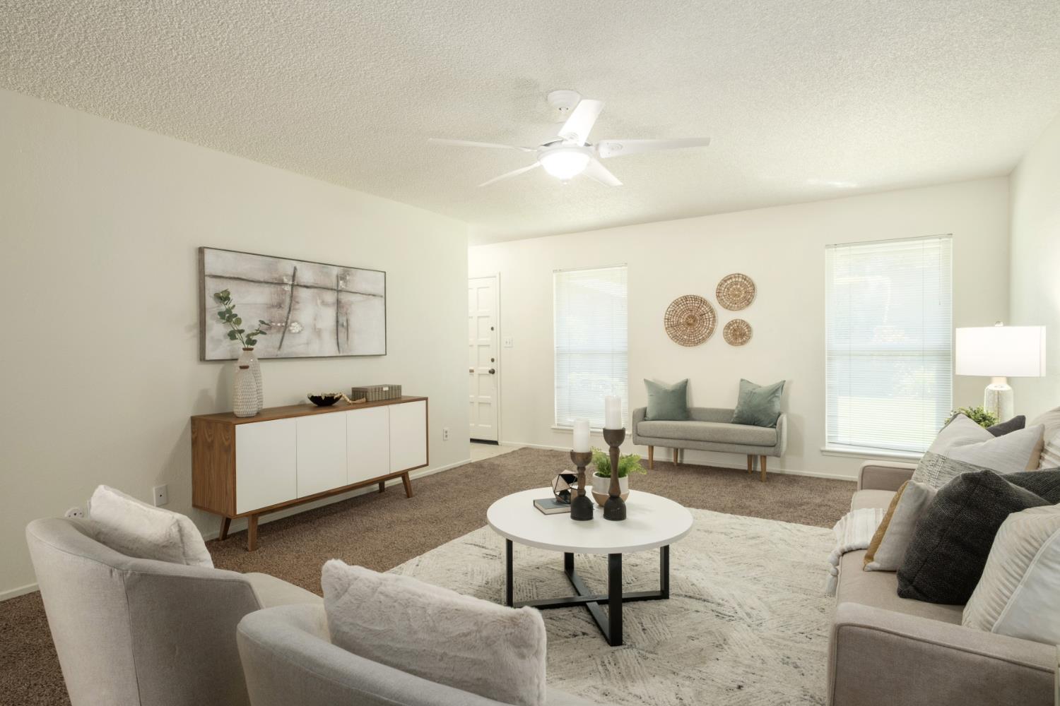 4849 North 7th Street, Unit F Fresno, CA 93726 - Photo 4 of 23 a living room with furniture and a large window
