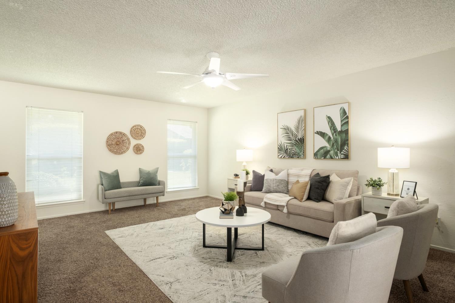 4849 North 7th Street, Unit F Fresno, CA 93726 - Photo 5 of 23 a living room with furniture and a large window