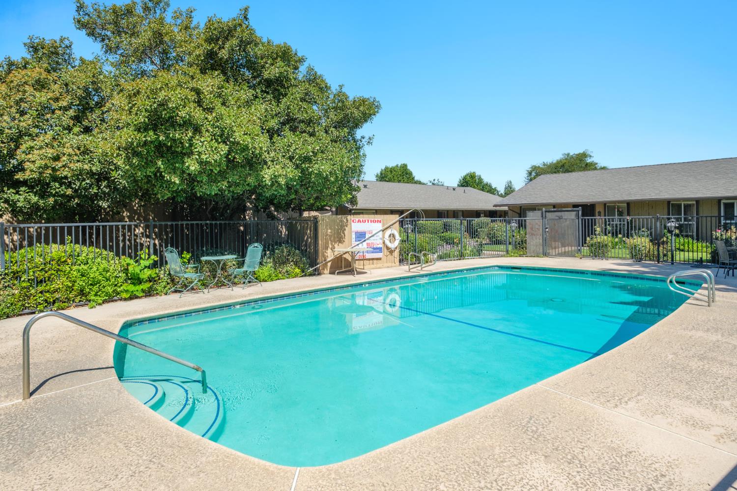 4849 North 7th Street, Unit F Fresno, CA 93726 - Photo 10 of 23 a view of a house with a swimming pool