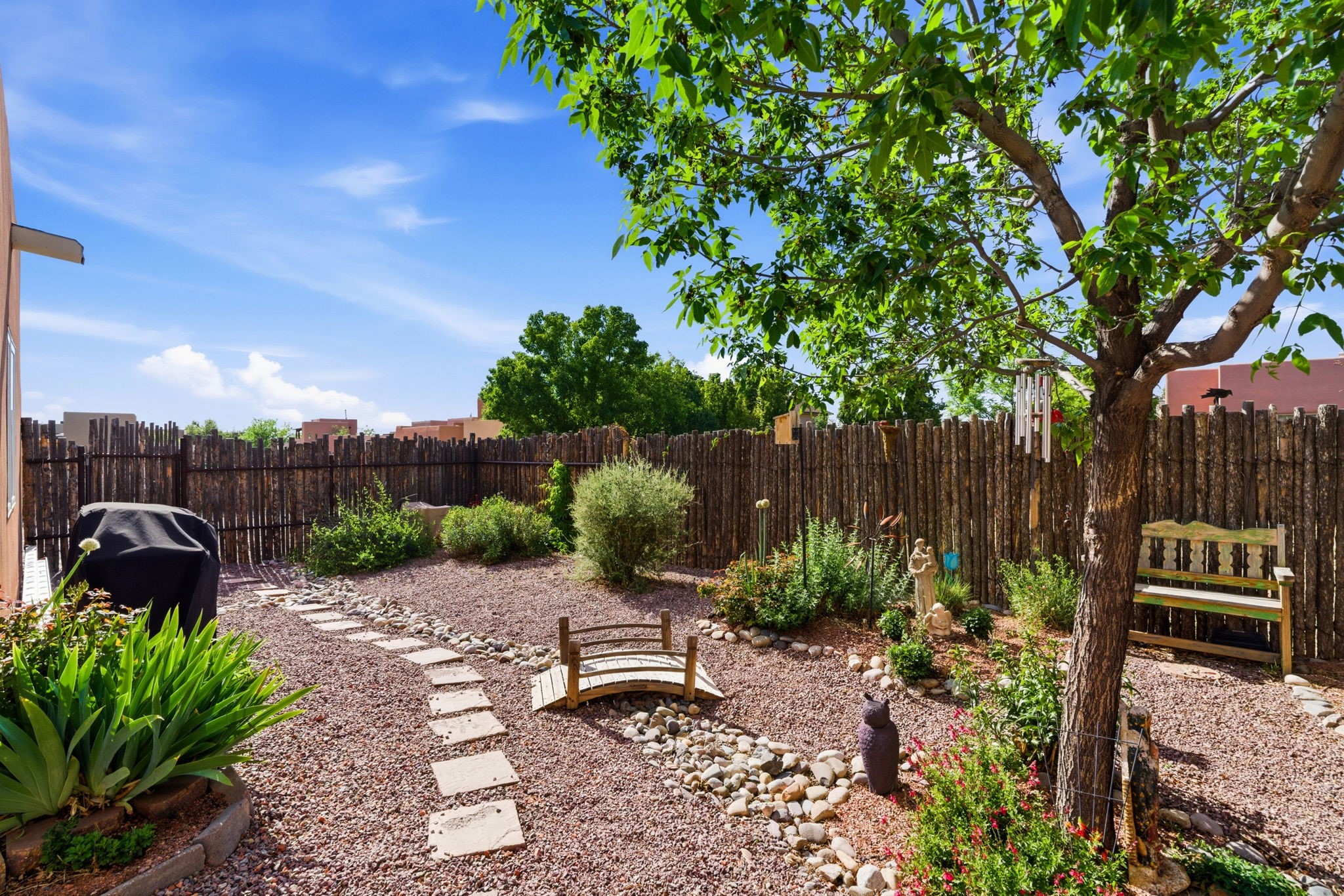 3 Silver Buckle Road Santa Fe, NM 87508 - Photo 29 of 34 Beautiful xeriscaped backyard with gray water irrigation system