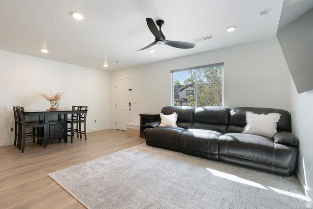 1693 Devils Gdn Lane Washington, UT 84780 - Photo 5 of 64 Open concept living area featuring wood-finish flooring, recessed lighting, and a ceiling fan