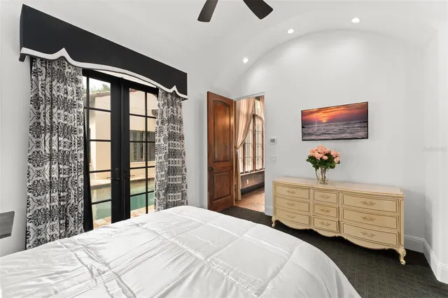 a bedroom with a bed chair and a couch