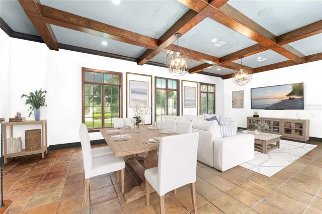 a living room with fireplace furniture and a flat screen tv