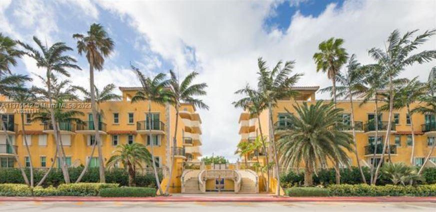 a view of a palm trees in front of a building