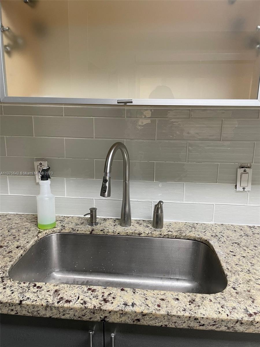 Normandy Beach Surfside, FL 33154 - Photo 15 of 32 a close view of sink and tap