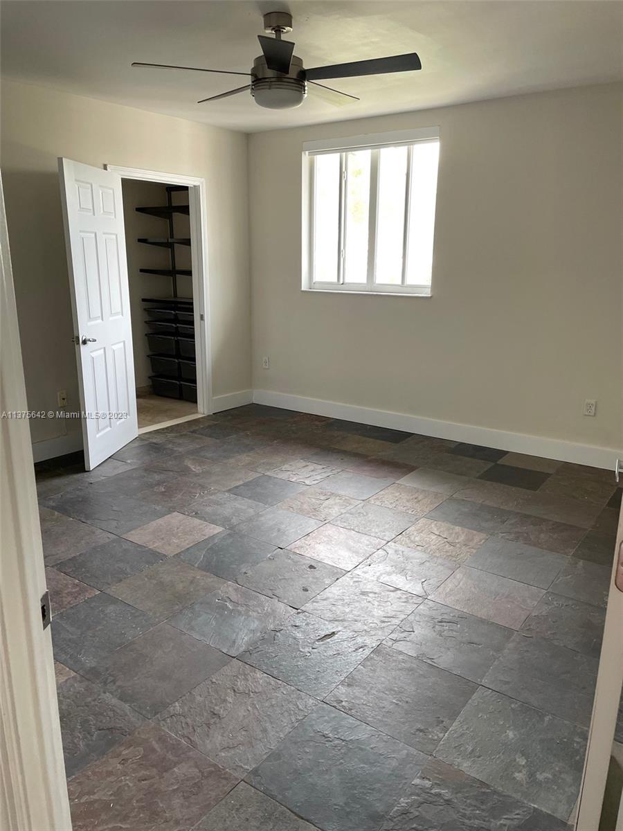 Normandy Beach Surfside, FL 33154 - Photo 26 of 32 an empty room with a empty space and windows