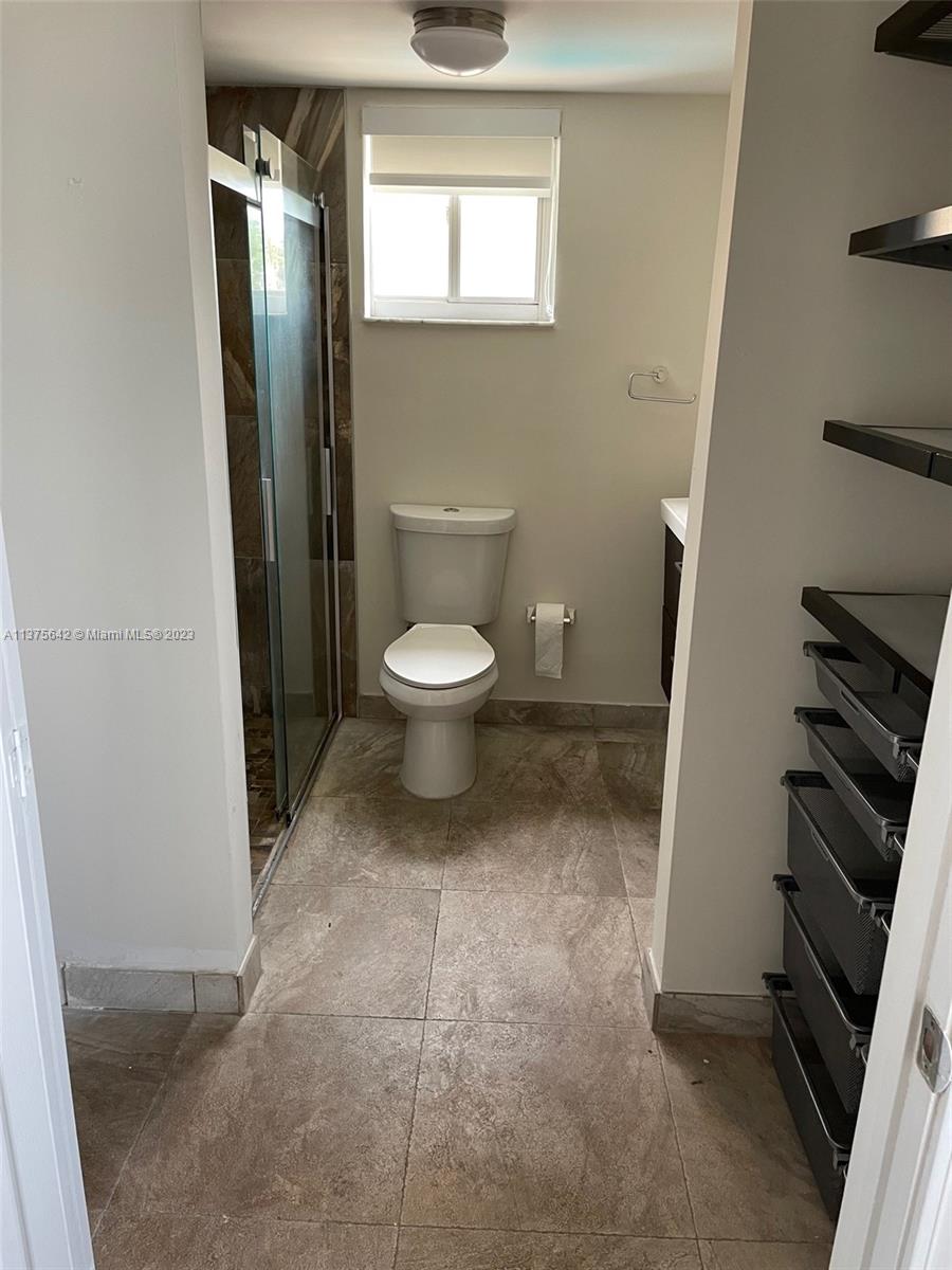 Normandy Beach Surfside, FL 33154 - Photo 29 of 32 a bathroom with a toilet